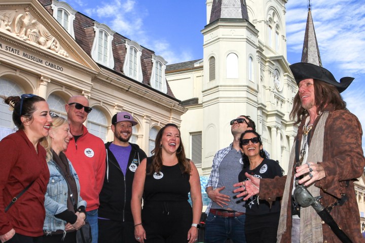 a group of people standing in front of a building